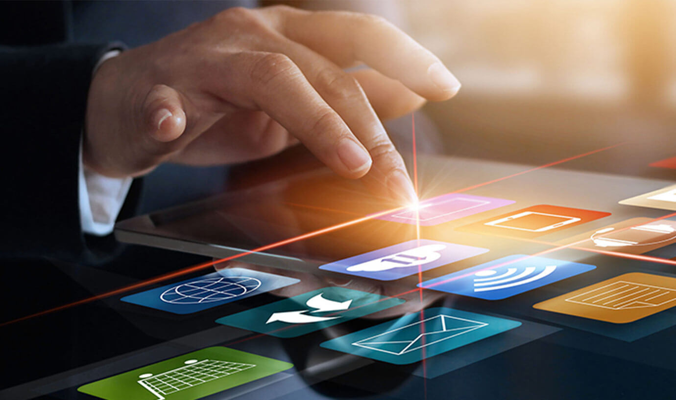 Finger touching pink icon on tablet